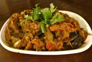 Spicy eggplant stir-fry garnished with fresh cilantro.
