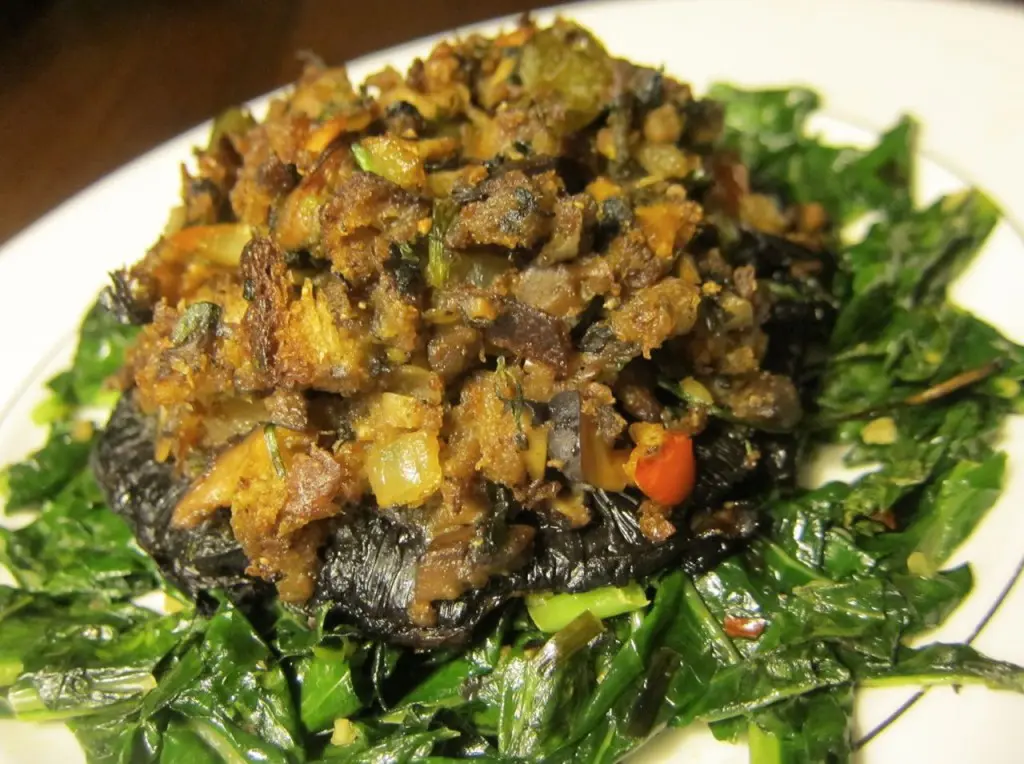 Savory sautéed mushrooms and vegetables on a bed of greens.