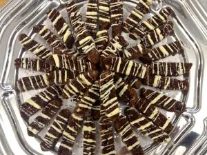 Chocolate and vanilla layered dessert bars arranged in a circle.