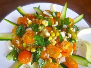 Fresh vegetable salad with cherry tomatoes and corn.