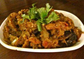 Spicy eggplant stir-fry garnished with fresh cilantro.