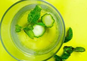 Refreshing cucumber and mint drink in a glass.