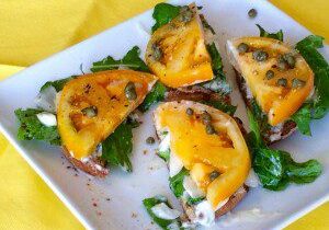 Toast topped with melted cheddar, caramelized onions, and fresh spinach.