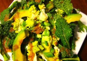 Fresh green salad with avocado and walnuts.