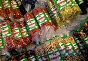 Various packaged dry foods and spices displayed for sale.