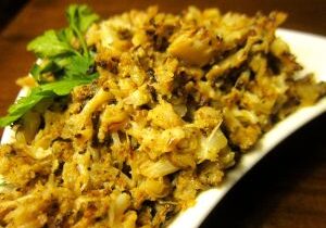 Close-up of a delicious scrambled egg dish with herbs.