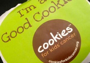 Green box with 'I'm a Good Cookie' and kids cancer charity logo.
