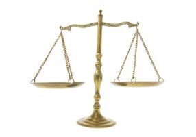 A classic brass balance scale with two empty pans.