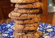 Stack of homemade oatmeal cookies on a blue patterned plate.