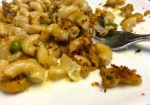 Close-up of creamy baked macaroni and cheese with a crispy topping.