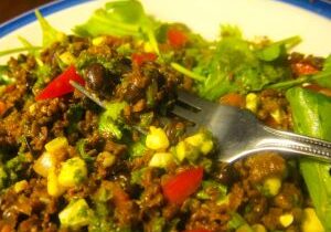 A colorful vegetable and lentil stir-fry with corn and red bell peppers.