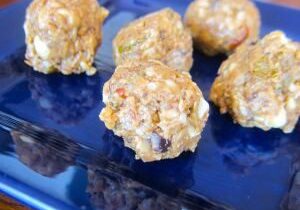 Close-up of homemade nutty energy balls on a blue plate.