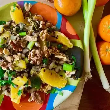 Colorful salad with oranges and walnuts.