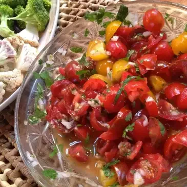 Tomato salad with herbs and vegetables.