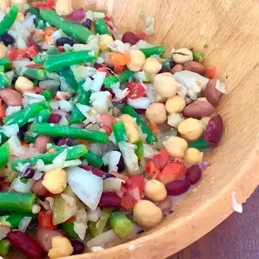 Mixed bean salad in wooden bowl.
