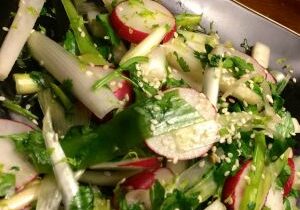 Fresh vegetable salad with sesame seeds and herbs.