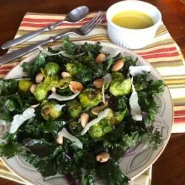Kale salad with almonds and dressing.
