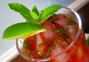 A refreshing mint and lime cocktail with ice cubes.