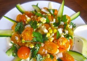 Fresh vegetable salad with cherry tomatoes and corn.